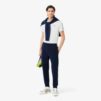 Polo de tenis Ultra Dry con rayas de la marca para hombre