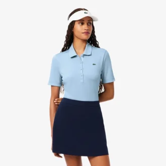 Polos de golf elásticos con protección UV y corte ajustado para mujer