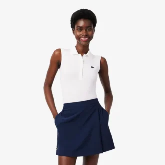 Polos de golf elásticos con protección UV y corte ajustado para mujer