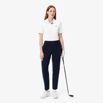 Polos de golf elásticos con protección UV y corte ajustado para mujer