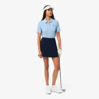 Polos de golf elásticos con protección UV y corte ajustado para mujer